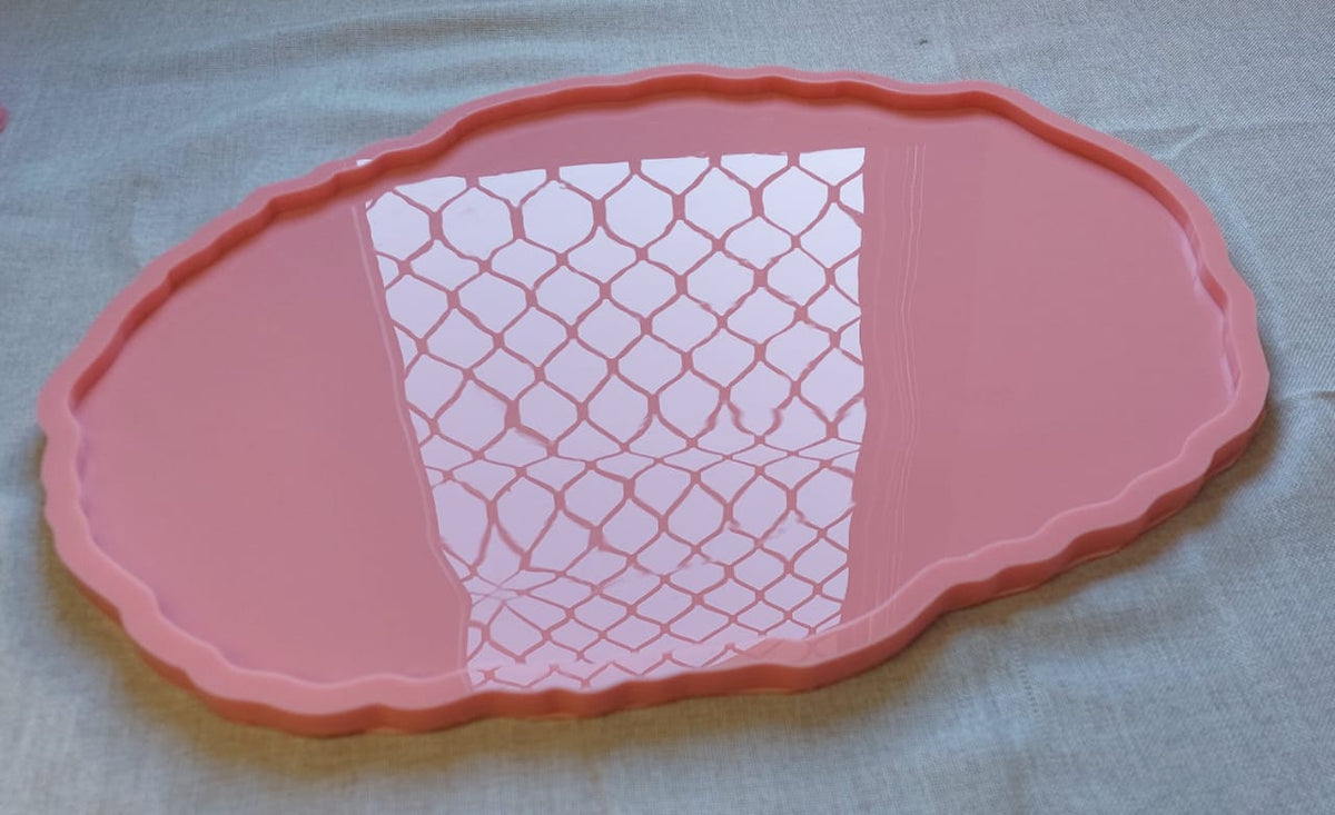 A silicone mold with irregular, wavy edges, typically used for casting resin or pottery to create large serving trays. Length: 48 cm, Width: 36 cm, Depth: 8 mm