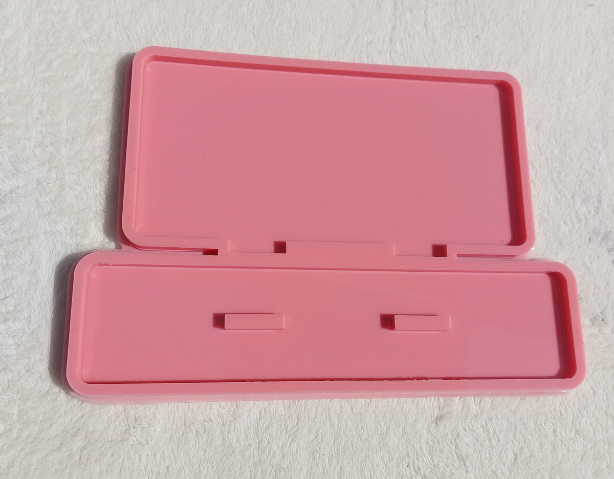 A silicone mold used for making welcome signs, desk plaques, desk calendars, earring organizers, accessories and decorations, nameplates, logos, small picture frames, light bases, or souvenirs. Designed for casting resin, wax, or ceramic