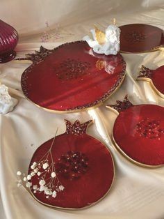 A silicone mold specially designed for crafting projects such as casting resin, polymer clay, wax, or pottery. The mold consists of two connected cavities shaped like a pomegranate, measuring 9 cm in length and 8 mm in depth.