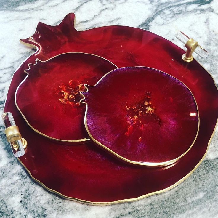 A silicone mold specially designed for crafting projects such as casting resin, polymer clay, wax, or pottery. The mold consists of two connected cavities shaped like a pomegranate, measuring 9 cm in length and 8 mm in depth.