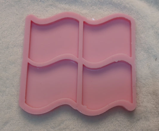 This silicone mold features a unique design resembling four interlocking wavy flags or a window shape with smooth edges, and is specifically designed for craft projects such as casting resin, polymer clay, wax, or pottery. Available in two different sizes