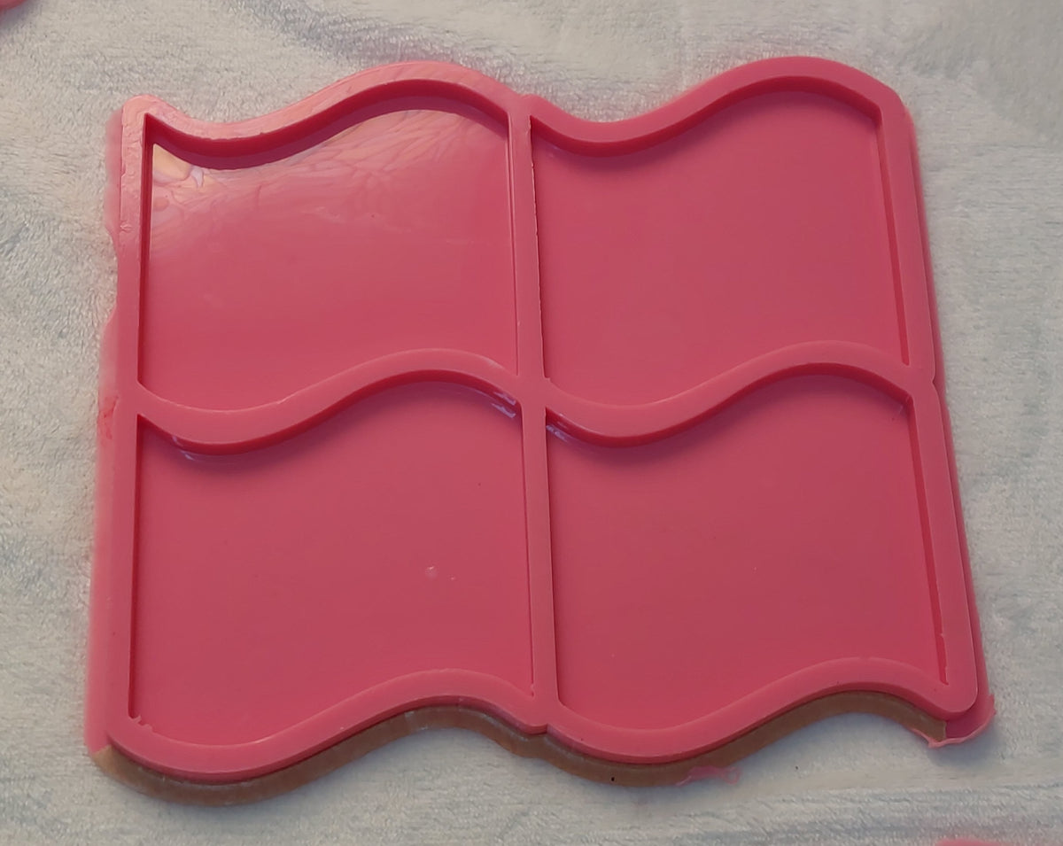 This silicone mold features a unique design resembling four interlocking wavy flags or a window shape with smooth edges, and is specifically designed for craft projects such as casting resin, polymer clay, wax, or pottery. Available in two different sizes