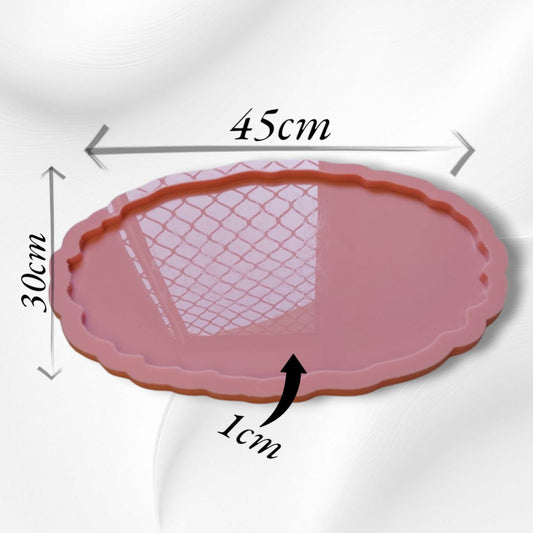 An oval silicone mold with regularly scalloped or wavy edges, ideal for creating large serving trays or decorative table centerpieces.  Length: 45 cm  Width: 30 cm  Depth: 1 cm