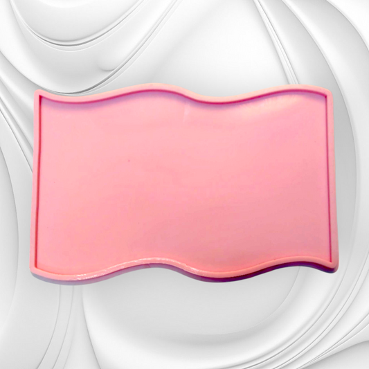 A sleek, rectangular silicone mold with an artistic touch, featuring wavy, wave-like edges on the top and bottom.  Size 42